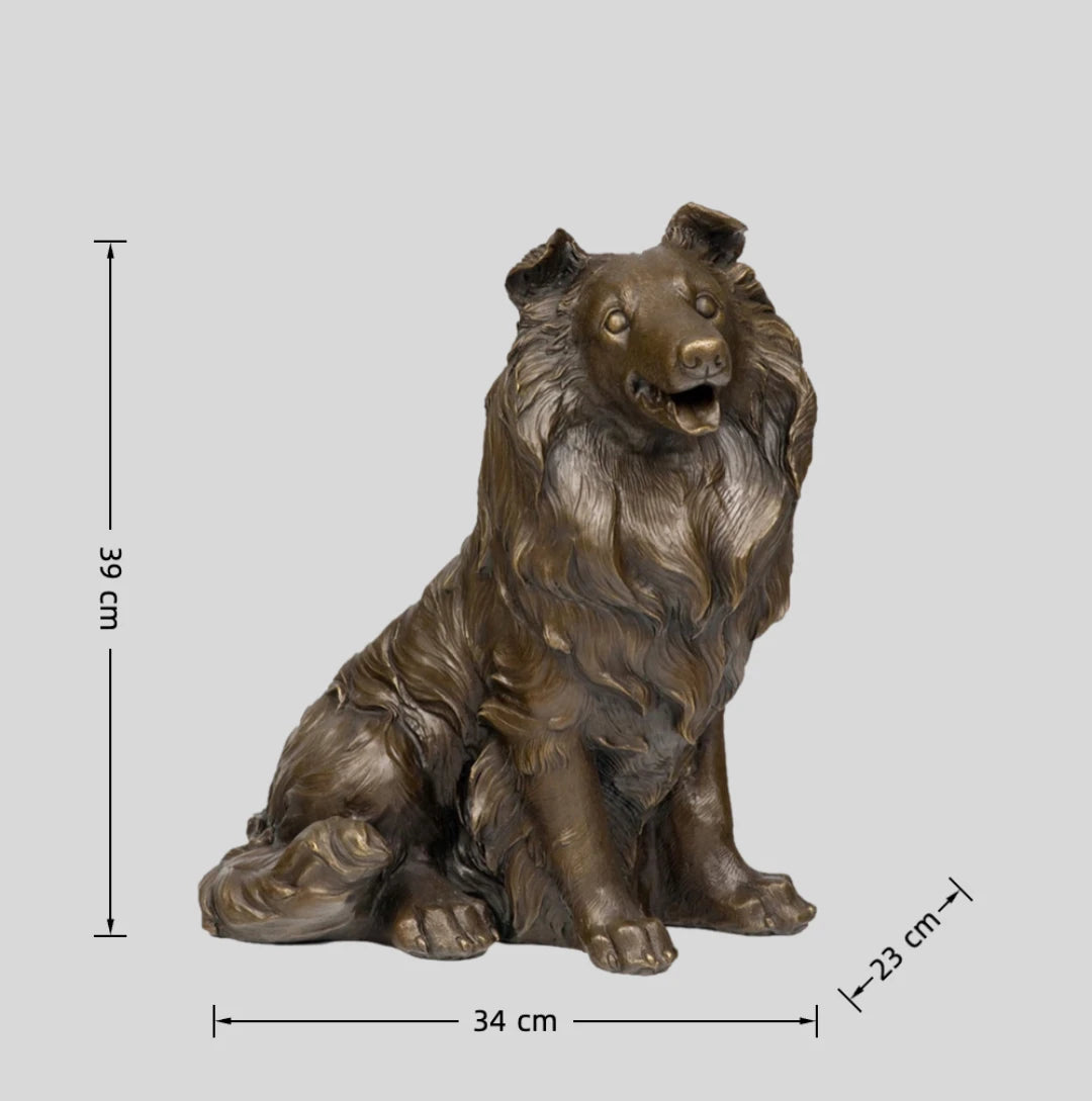 This is a lifelike bronze sculpture of a collie dog, crafted using the lost-wax casting method. The piece captures the dog in a seated pose, with its mouth open in a friendly, alert expression, conveying warmth and intelligence. The rich, warm bronze patina accentuates the intricate, flowing texture of its long, wavy coat, which cascades down its neck and body in detailed, lifelike folds.