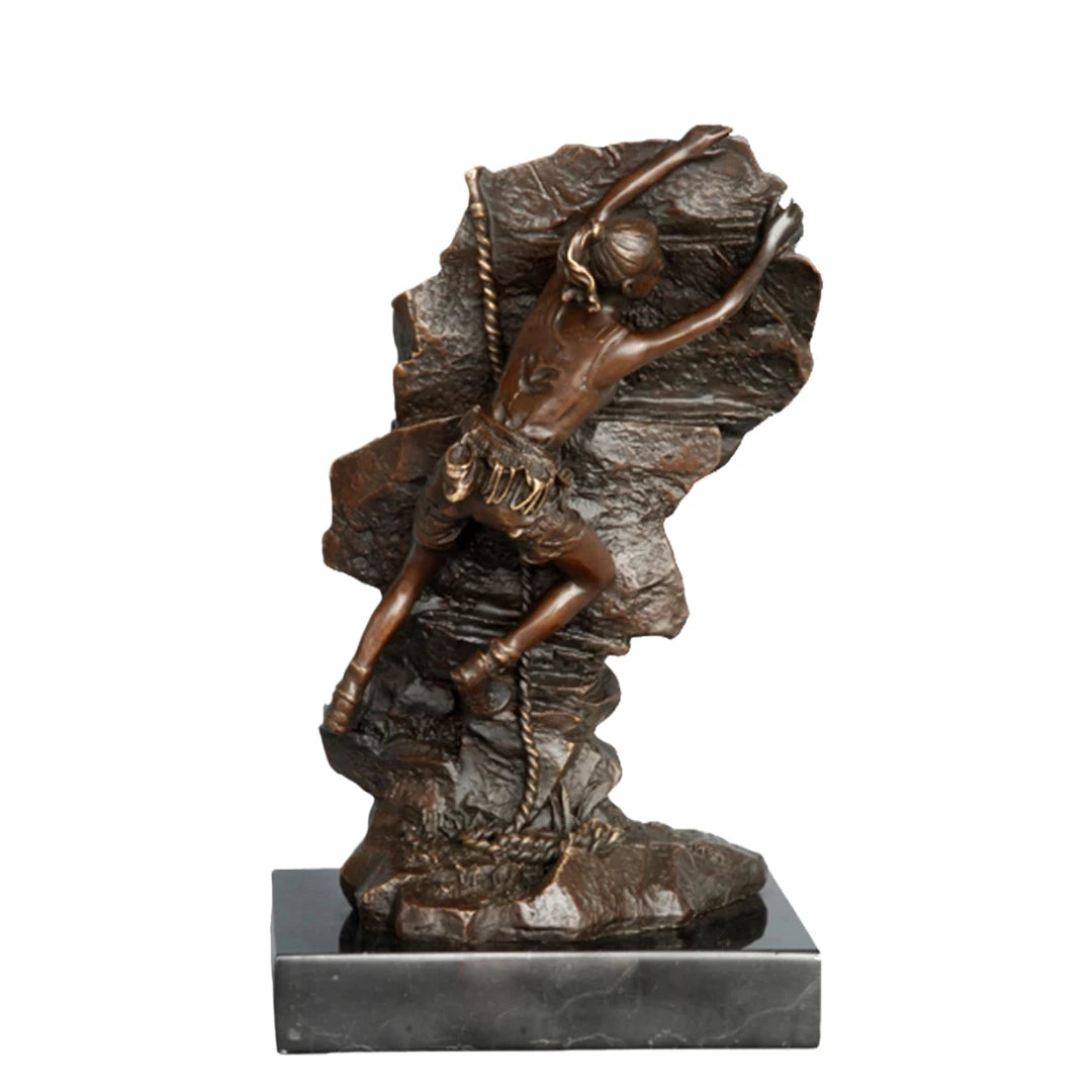 This striking bronze sculpture portrays a female rock climber captured in a moment of intense ascent, embodying both physical strength and mental determination. Created using the traditional lost-wax casting method, the sculpture showcases exceptional craftsmanship and attention to detail. The climber’s body is pressed closely against the rugged rock surface, with one arm reaching upward in pursuit of the next hold—an expressive gesture that conveys motion, tension, and purpose.