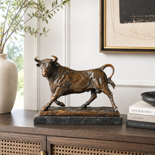 Embody the power of success with our Charging Wall Street Bull Bronze Statue . Hand-cast in solid bronze on a marble base, this realistic "Bull Market" sculpture is a commanding symbol of strength and prosperity for the office.
