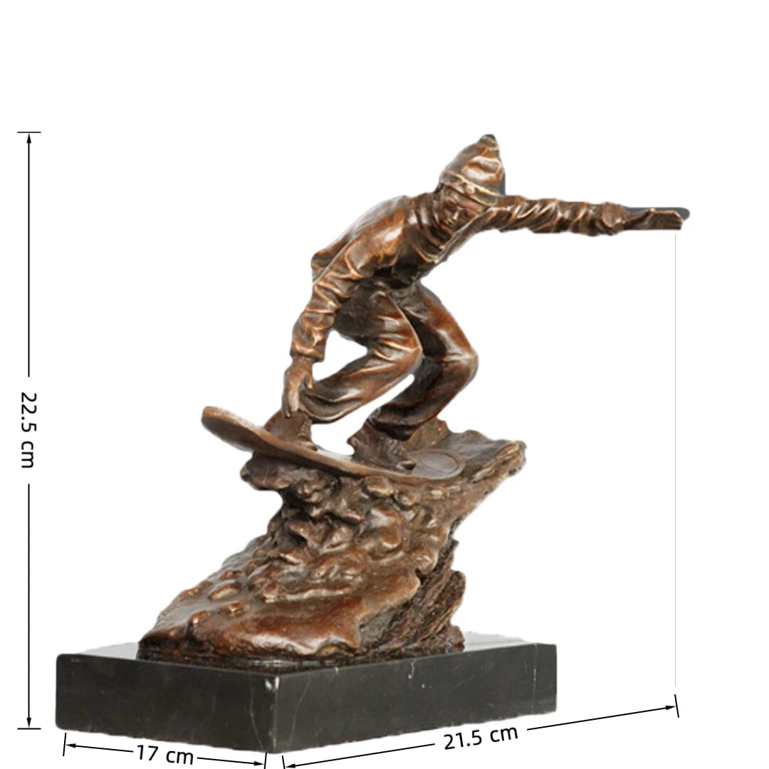 This is a dynamic bronze sculpture of a snowboarder, crafted using the lost-wax casting method. The piece captures the athlete mid-action, crouched low on their board while navigating a rugged, snow-like terrain, with one arm extended for balance. The rich, warm bronze patina accentuates the fluid folds of the snowboarder’s jacket and pants, as well as the textured, naturalistic base that simulates snowdrifts.