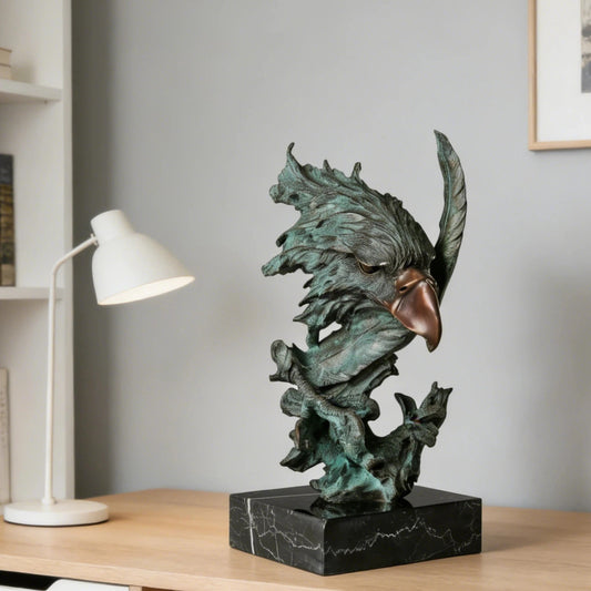 Abstract bronze eagle head sculpture with striking verdigris patina and marble base. A bold wildlife statue symbolizing freedom, strength, and vision.