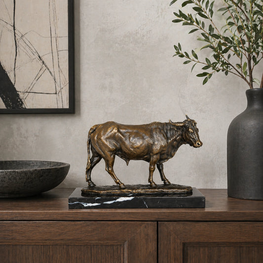 Naturalistic bronze walking bull sculpture with lifelike detail and strong posture
