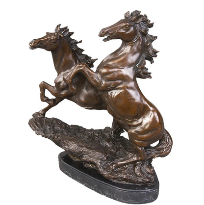 This is a dynamic bronze sculpture of two galloping horses, crafted using the lost-wax casting method. The piece captures the raw energy and competitive spirit of the horses as they surge forward, with one rearing high and the other leaping alongside. The rich, warm bronze patina and smooth, polished finish accentuate the powerful musculature and fluid forms of the animals, while their manes and tails flow backward, as if caught in the wind, conveying a sense of unbridled speed and vitality.