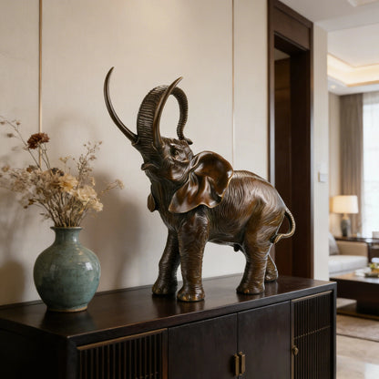 This is a vibrant bronze sculpture of an African elephant, crafted using the lost-wax casting method. 