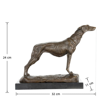 This is an elegant bronze sculpture of a greyhound, crafted using the lost-wax casting method and bearing the signature of a master animalier sculptor. The piece captures the dog in a poised, alert stance, with its head held high and body stretched forward, conveying the breed’s characteristic grace, speed, and athleticism. The rich, warm bronze patina accentuates the dog’s lean, muscular physique, the smooth texture of its short coat, and the delicate details of its collar.