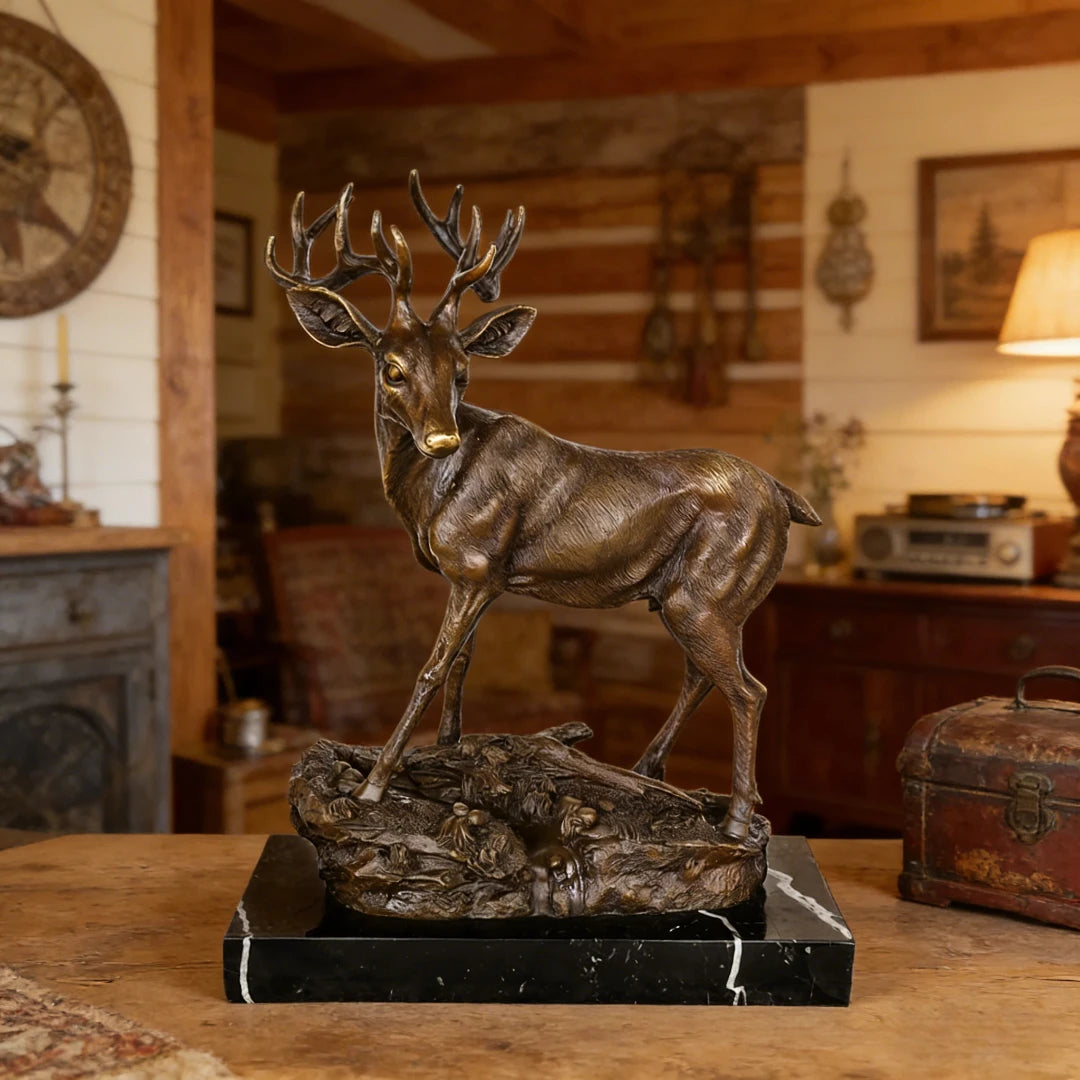 Handcrafted bronze stag sculpture featuring detailed antlers and naturalistic base. Lost-wax cast deer statue on marble base, ideal for luxury home decor.