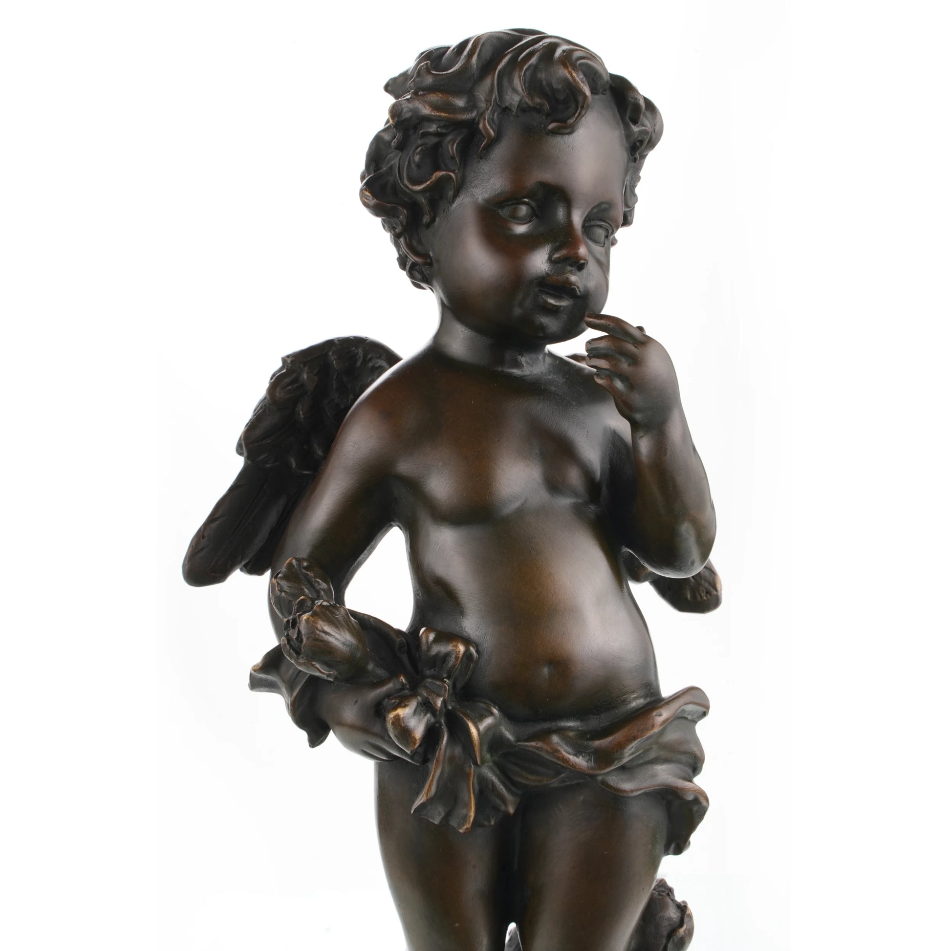 Bronze cherub cupid statue with wings on marble base.Close-up of cherub face and expression in bronze