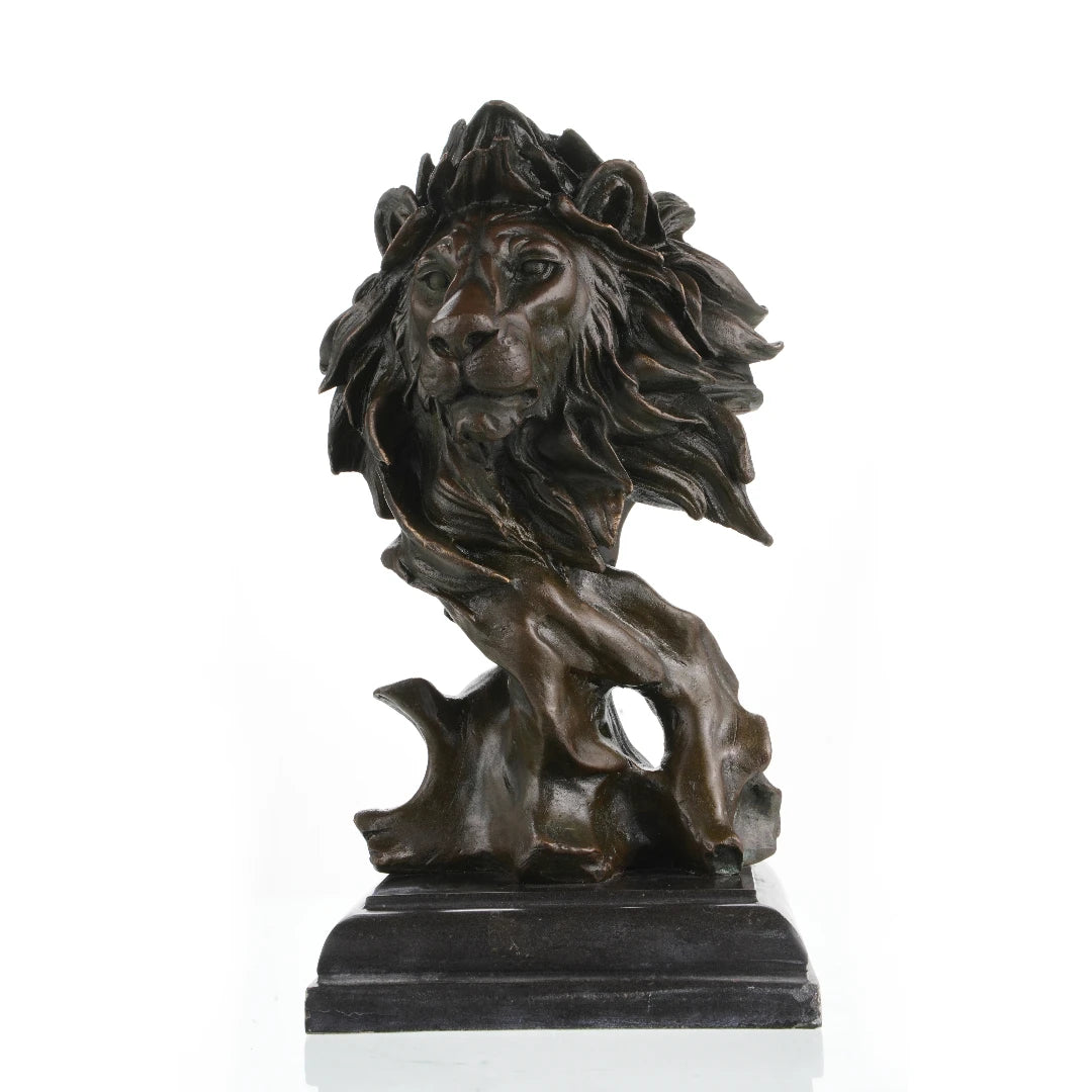 This is a striking bronze bust of a lion, crafted using the lost-wax casting method. The sculpture focuses on the lion’s head and upper neck, capturing the animal in a moment of quiet intensity, with its mane rendered in dynamic, flowing forms that suggest movement and raw power. The deep, rich bronze patina accentuates the intricate details of the lion’s facial features—from the intense gaze of its eyes to the texture of its whiskers—and the dramatic, almost wind-swept folds of its mane.