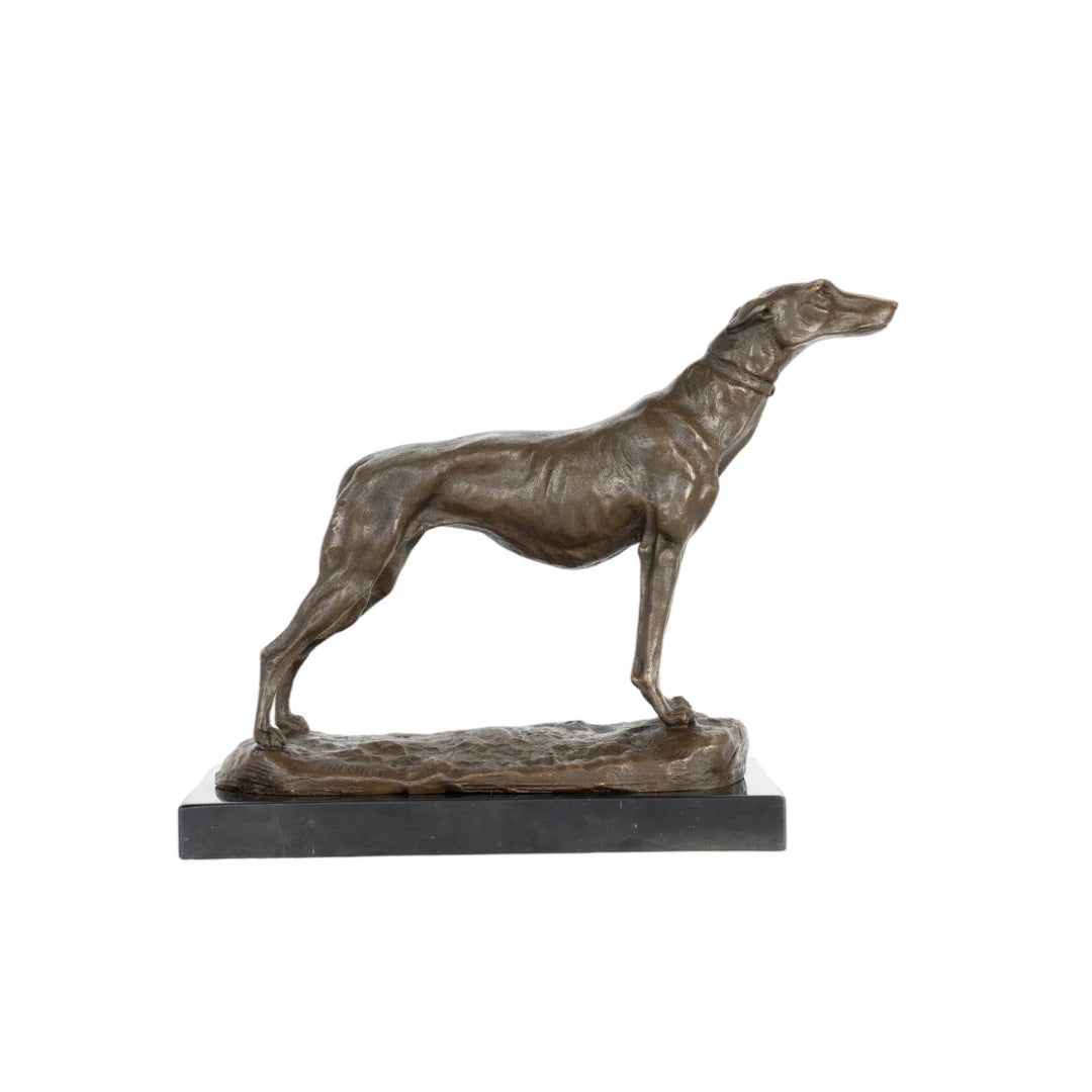 This elegant bronze greyhound sculpture is crafted using the traditional lost-wax casting method and bears the signature of a master animalier sculptor. The dog is depicted in a poised, alert stance with its head raised and body extended forward, expressing grace and athletic strength. The warm bronze patina highlights its lean musculature and smooth coat. Set on a naturalistic bronze base and dark marble plinth, this sculpture combines realism with refined presentation, making it a distinguished accent for