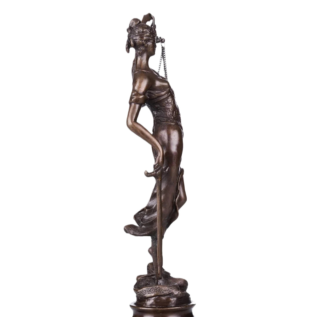 This bronze sculpture portrays Lady Justice (Justitia), the timeless symbol of law, fairness, and moral authority. Draped in a classical robe with finely sculpted folds, the figure conveys dignity and balance.
