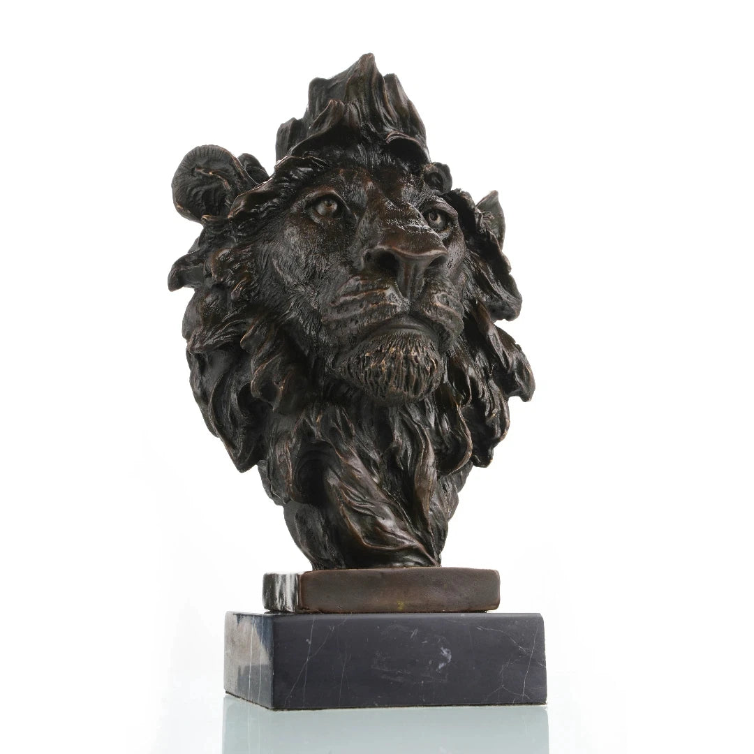 This powerful bronze lion bust is crafted using the traditional lost-wax casting method, capturing the animal’s head and upper neck with remarkable realism. The rich bronze patina highlights the lion’s piercing gaze, detailed whiskers, and dynamic, wind-swept mane, conveying strength and regal authority. The sculpture is mounted on a solid bronze block and dark marble plinth, enhancing its stability and grand presence.