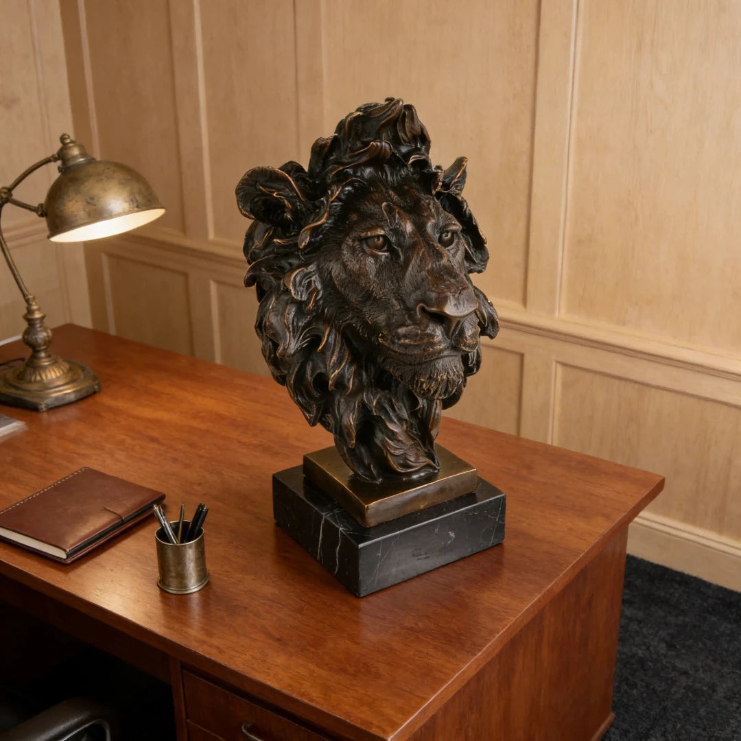 This powerful bronze lion bust is crafted using the traditional lost-wax casting method, capturing the animal’s head and upper neck with remarkable realism. The rich bronze patina highlights the lion’s piercing gaze, detailed whiskers, and dynamic, wind-swept mane, conveying strength and regal authority. The sculpture is mounted on a solid bronze block and dark marble plinth, enhancing its stability and grand presence.