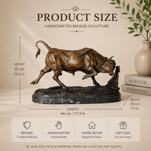 Bronze bullfight sculpture with charging bull and matador cape in dynamic action scene