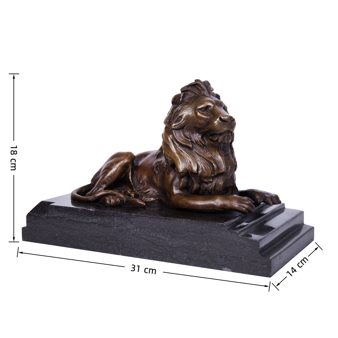 This majestic bronze lion sculpture, crafted using the lost-wax casting method, captures the animal in a poised, reclining stance. The rich bronze patina highlights the lion’s powerful musculature and flowing mane, while its elevated head and relaxed posture convey quiet authority and regal composure. Mounted on a stepped dark marble plinth, the sculpture exudes stability, grandeur, and timeless elegance, making it ideal for refined interiors or as a distinguished art collection piece.