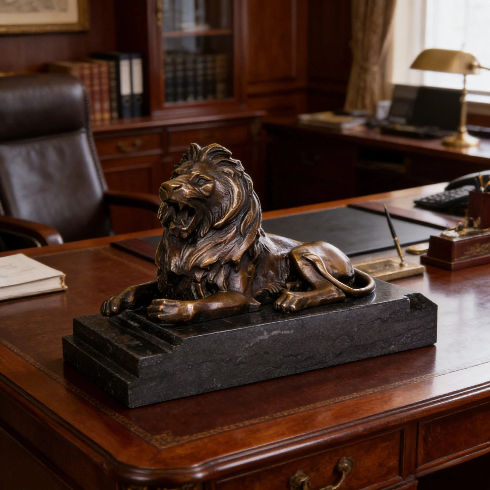 This is a powerful bronze lion sculpture, cast using the lost-wax method, depicting the animal in a reclining pose with its mouth open in a fierce roar. The sculpture features a rich, aged bronze patina that highlights the intricate, flowing details of its mane and the taut musculature of its body, conveying a sense of primal strength and authority. The lion’s head is raised, and its expression is intense, while its body rests in a relaxed yet alert posture, suggesting a moment of warning or dominance.