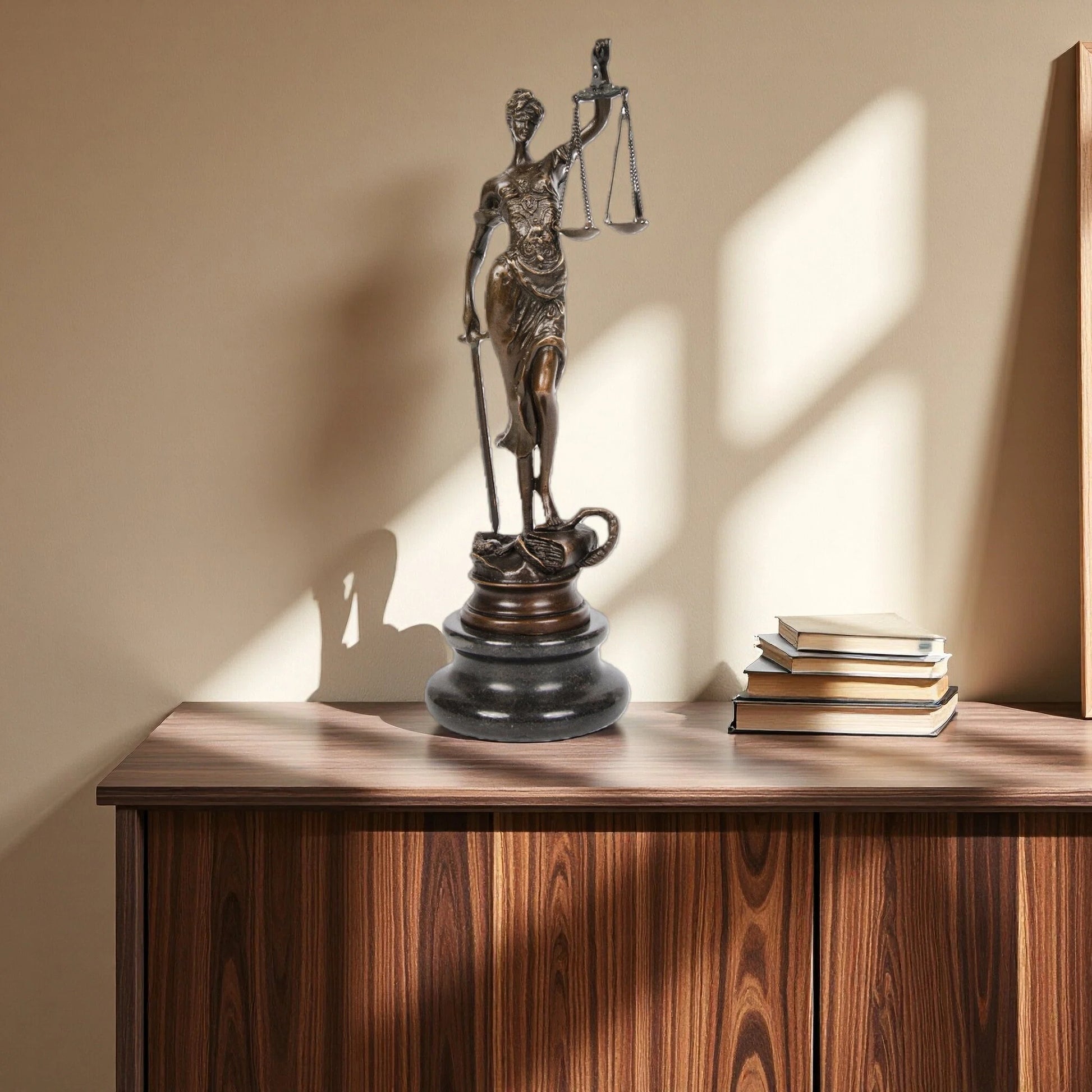 This bronze sculpture portrays Lady Justice (Justitia), the timeless symbol of law, fairness, and moral authority. Draped in a classical robe with finely sculpted folds, the figure conveys dignity and balance.