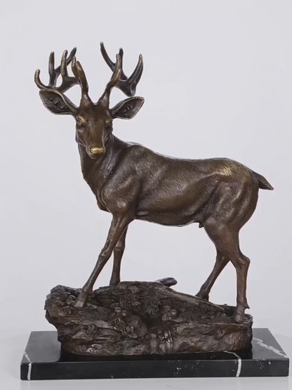 Handcrafted bronze stag sculpture featuring detailed antlers and naturalistic base. Lost-wax cast deer statue on marble base, ideal for luxury home decor.