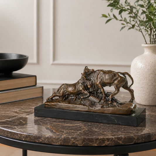 Bronze sculpture of two bulls fighting with dynamic movement and detailed musculature